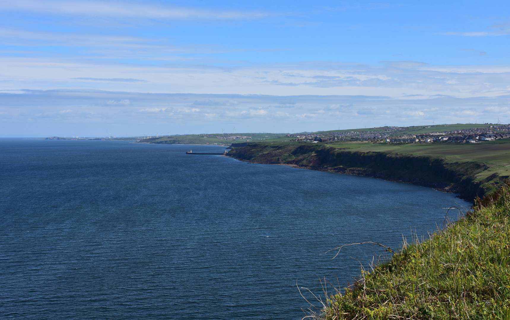 An image depicting the trail Cumbria Coastal Way and its surrounding area.