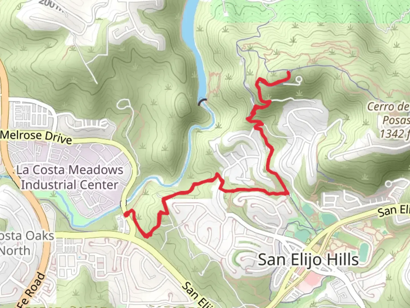An image depicting the trail Cerro de las Posas from Melrose Drive and its surrounding area.