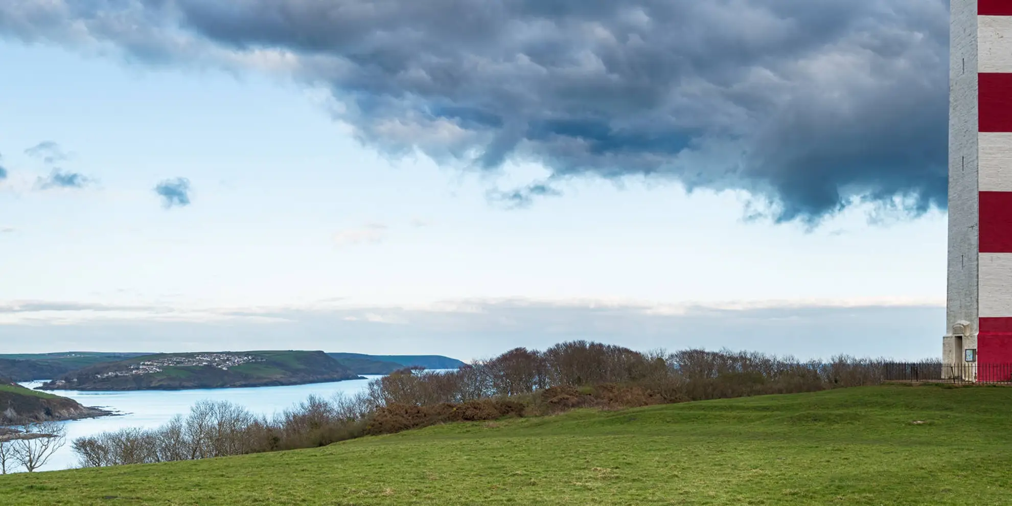 An image depicting the trail Gribbin Head and Polkerris from Polruan and its surrounding area.