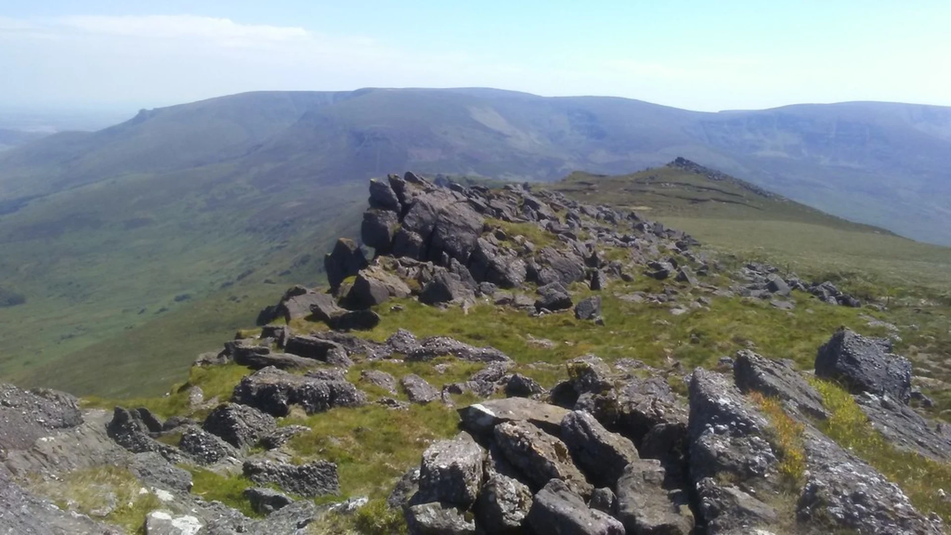 An image depicting the trail Knockanaffrin Ridge and its surrounding area.