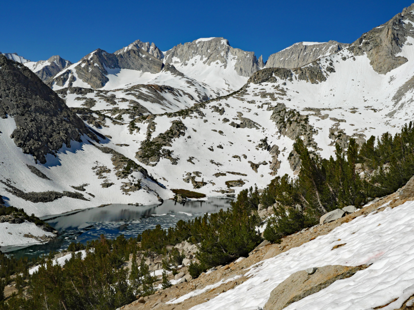 An image depicting the trail Ruby Lake via Little Lakes Valley Trail and its surrounding area.