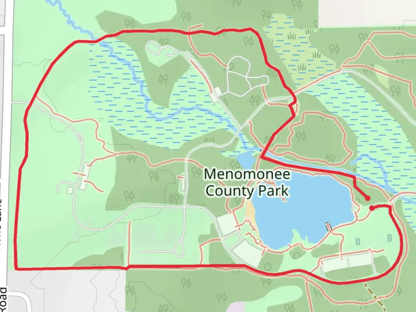 An image depicting the trail Menomonee County Park Loop and its surrounding area.