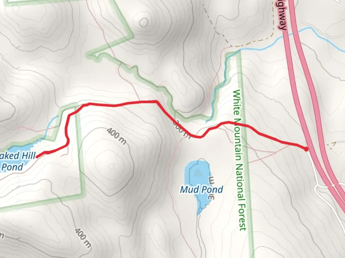 An image depicting the trail Peaked Hill Pond and its surrounding area.