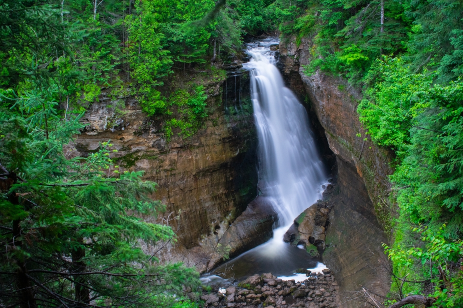 An image depicting the trail Miners Falls and its surrounding area.