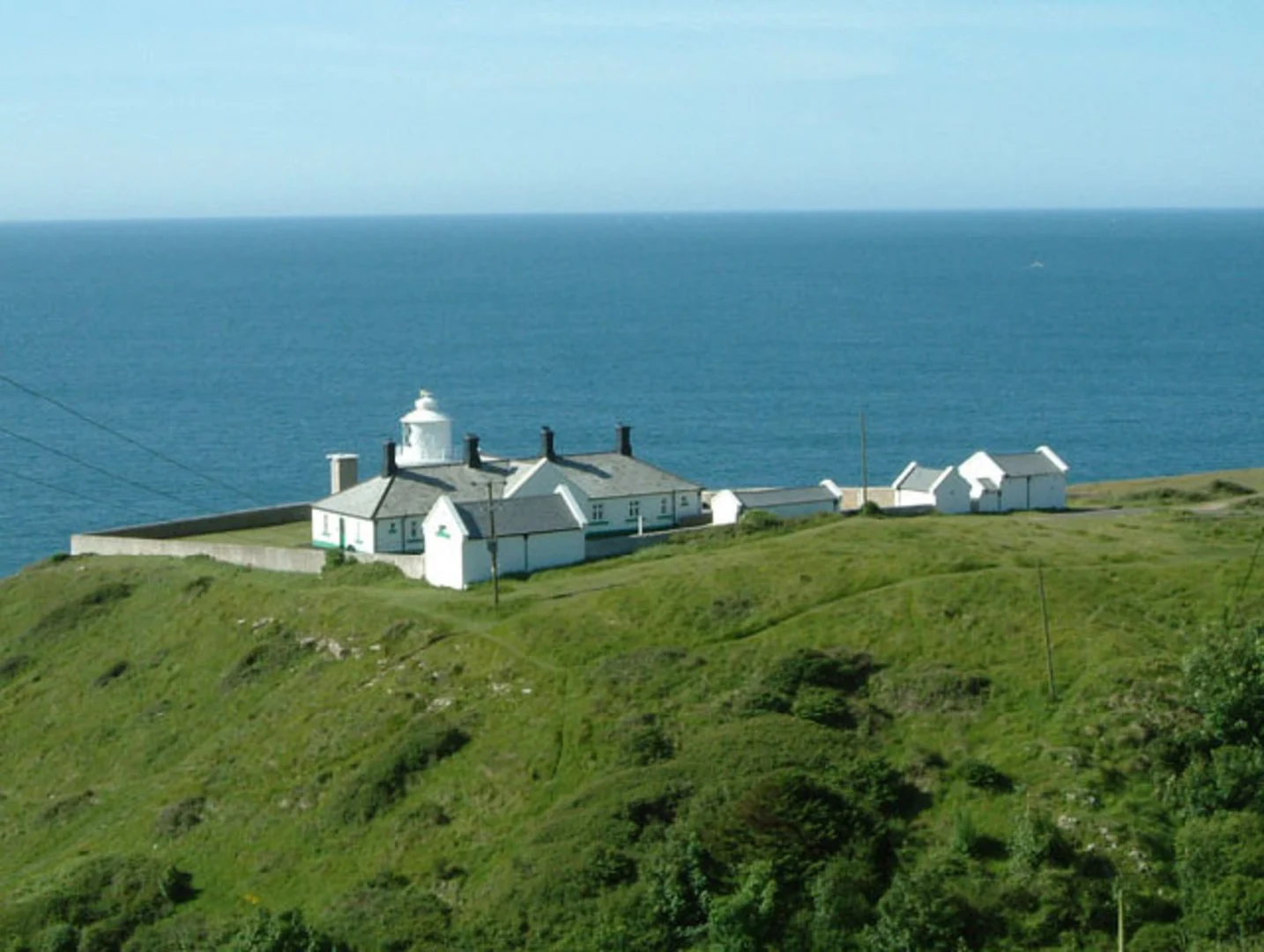 An image depicting the trail Peveril Point to Anvil Point Walk and its surrounding area.