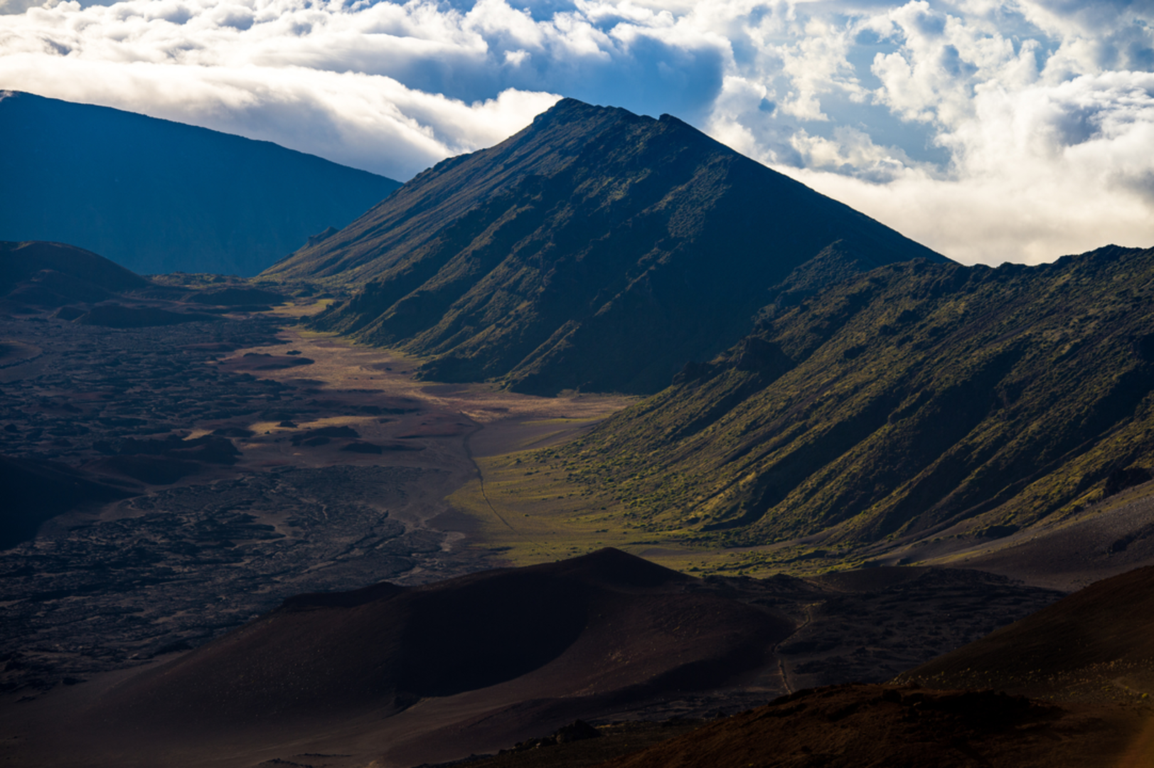 An image depicting the trail Kapalaoa Cabin via Sliding Sands Trail and its surrounding area.