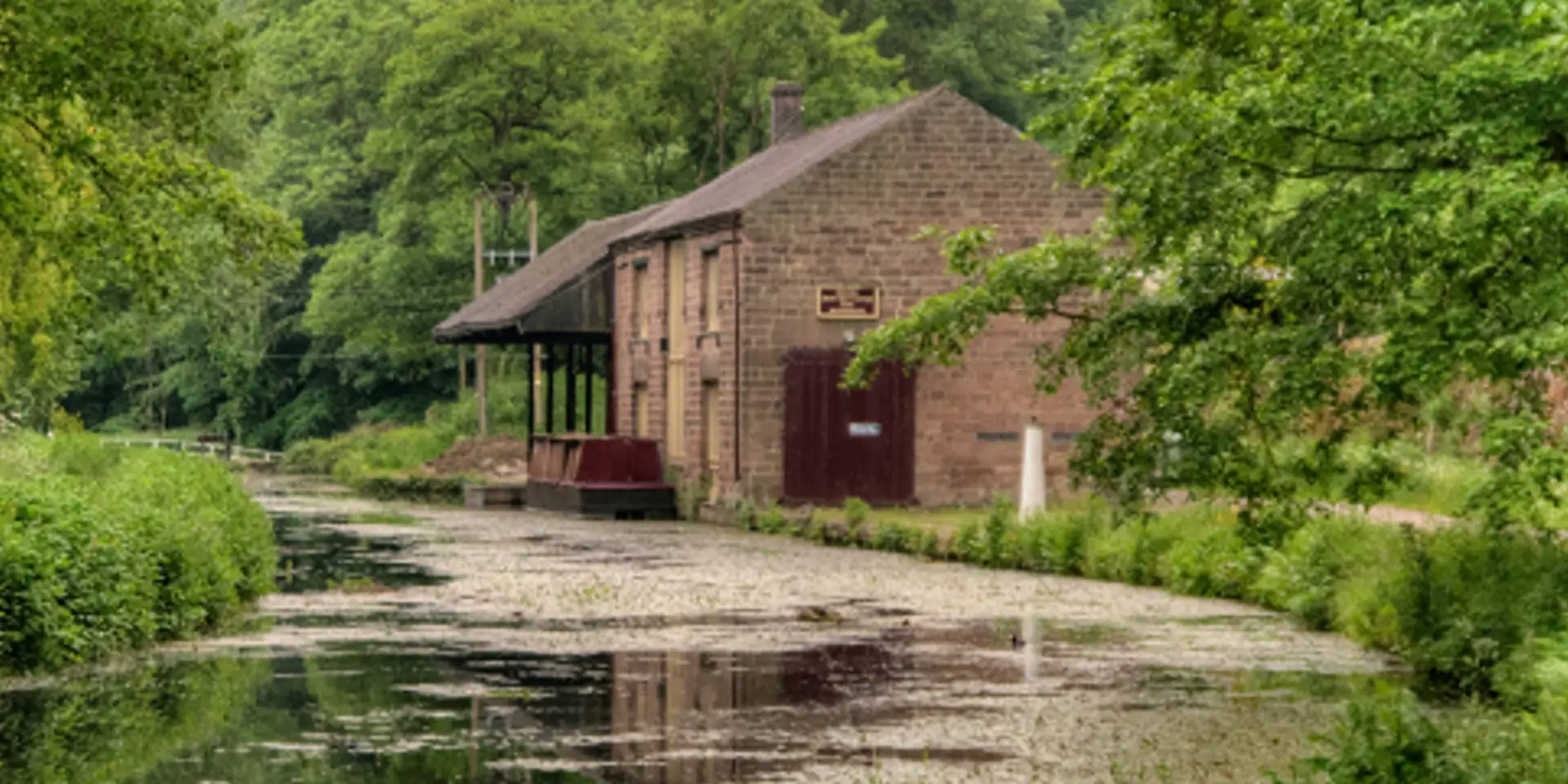 An image depicting the trail Cromford Canal and Black Rocks from High Peak Junction and its surrounding area.