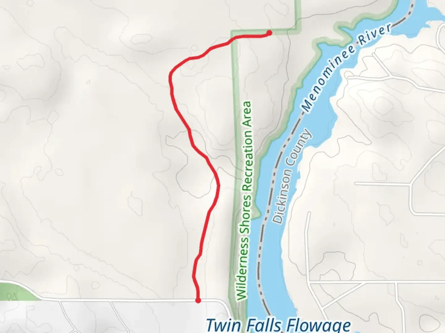 An image depicting the trail Menominee River Walkalong and its surrounding area.