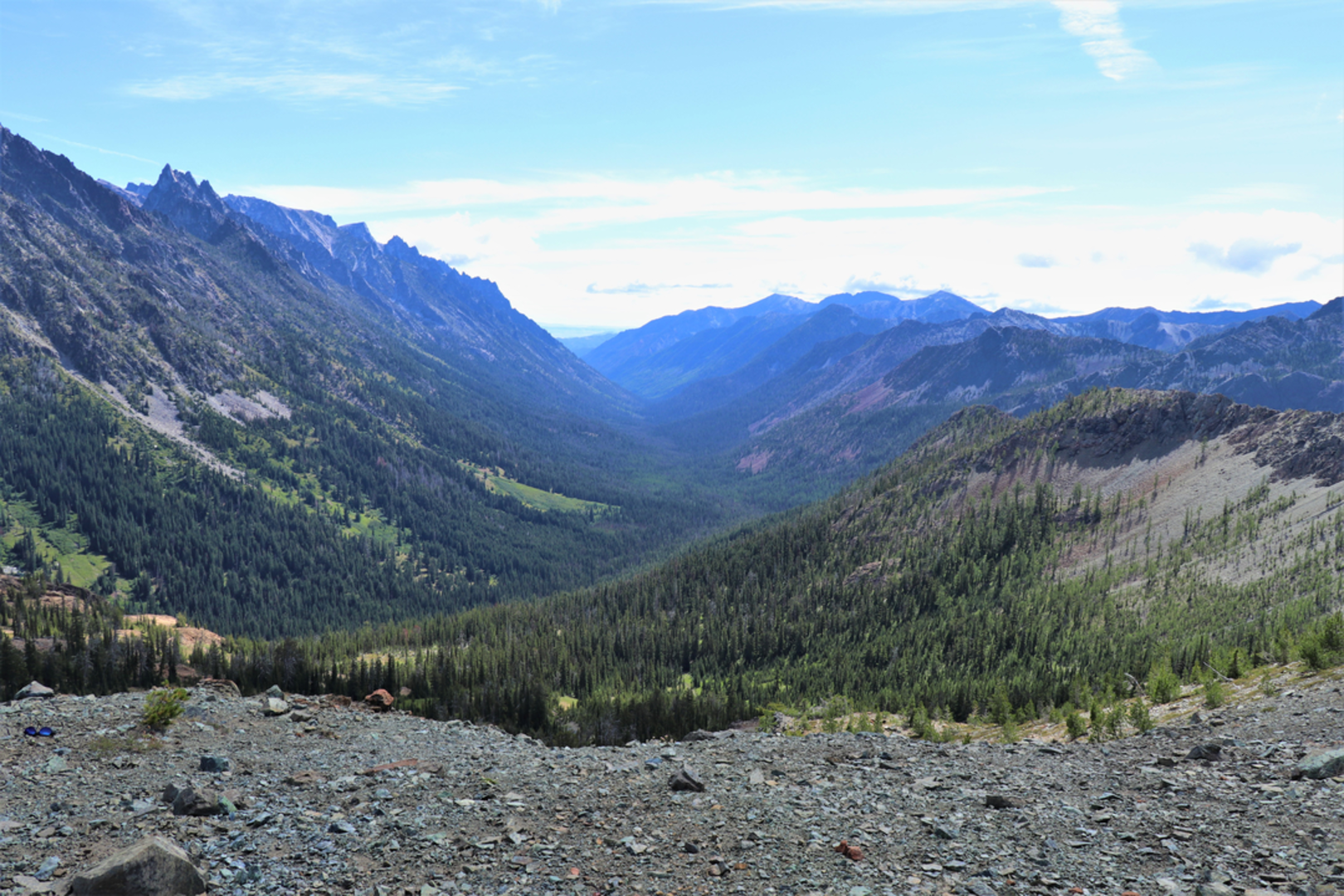 An image depicting the trail Longs Pass Trail via Esmeralda Basin Trail and its surrounding area.