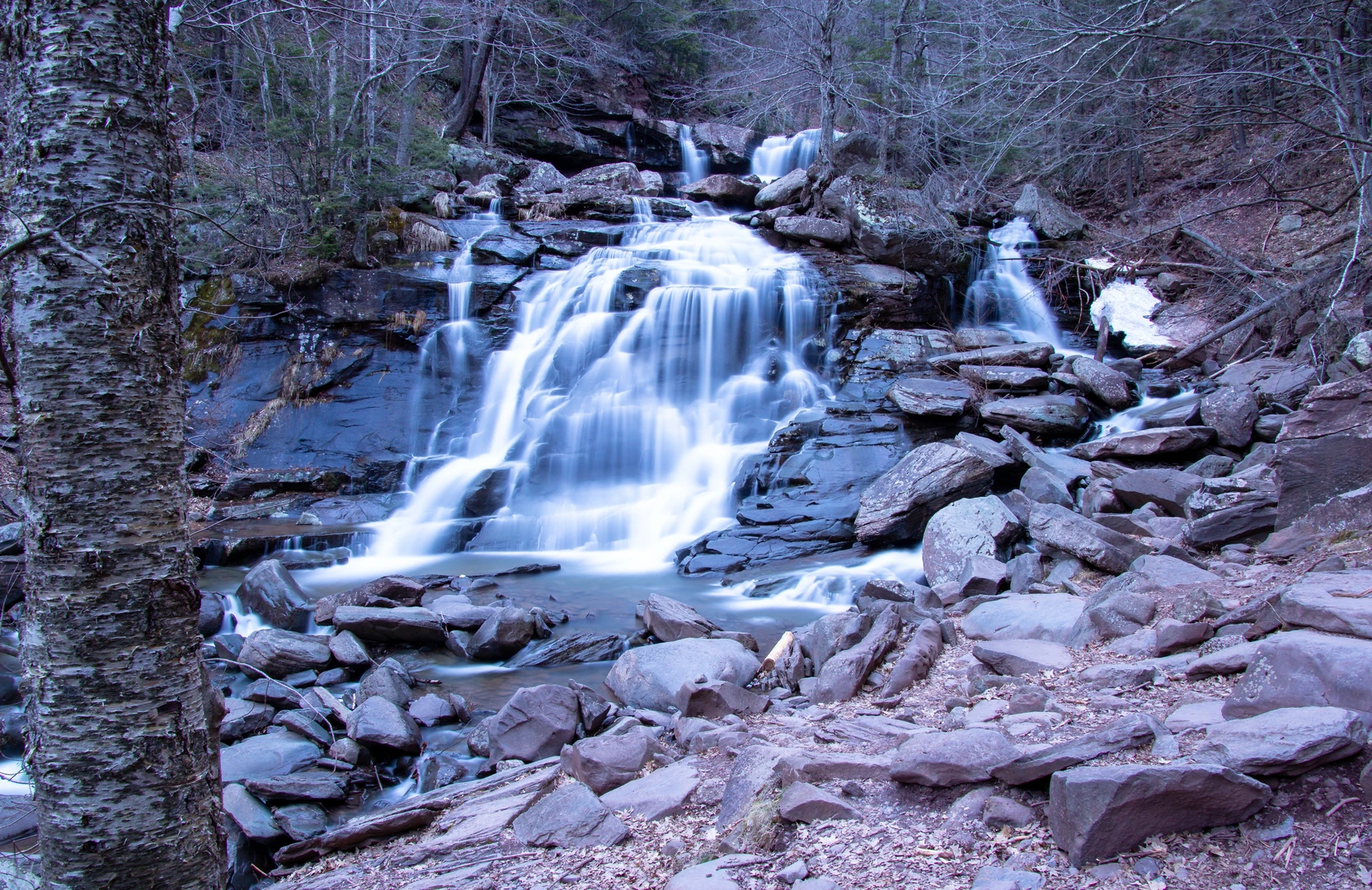 An image depicting the trail Haines Falls via Kaaterskill Rail Trail and its surrounding area.