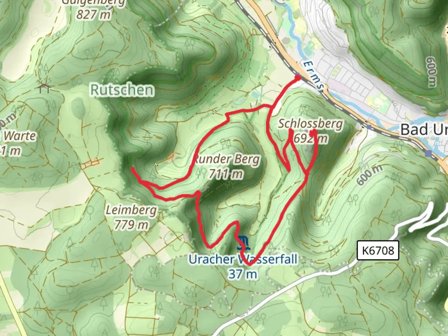 An image depicting the trail Schlossberg via Fohlensteige and Schwaebische-Alb-Nordrand Weg and its surrounding area.