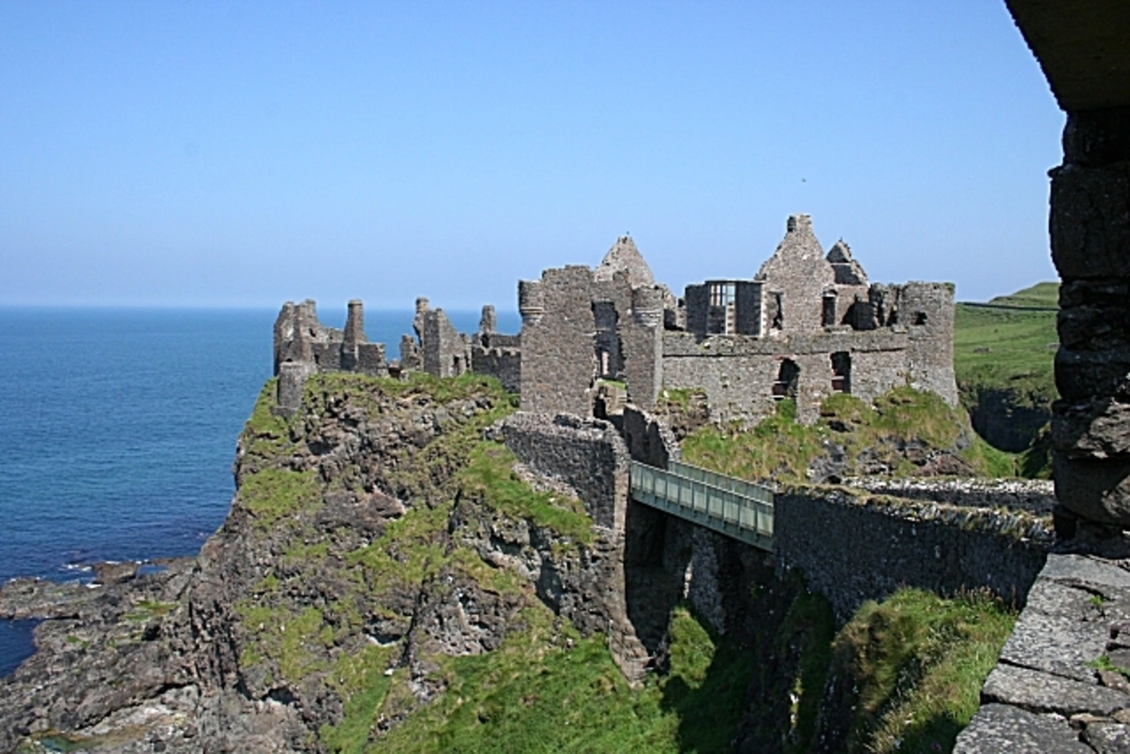 An image depicting the trail Dunluce Castle and its surrounding area.