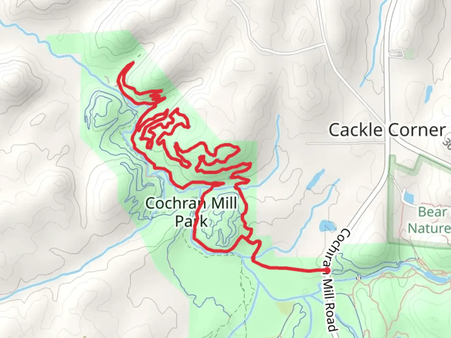 An image depicting the trail Red Trail and 5 Turn Hill Loop and its surrounding area.