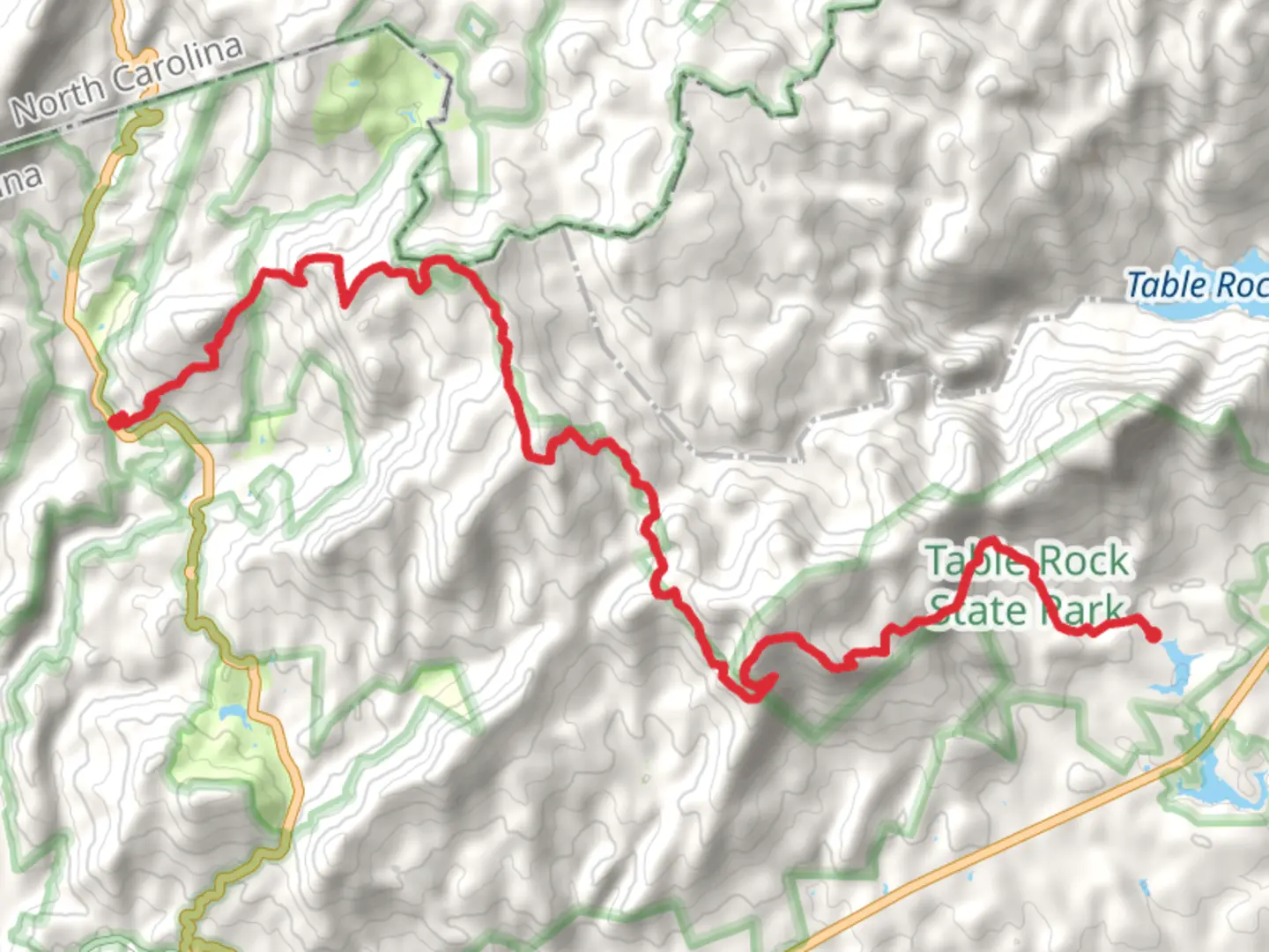 An image depicting the trail Chimneytop, Sassafras, Hickorynut and Pinnacle Mountains via Foothills Trail and its surrounding area.