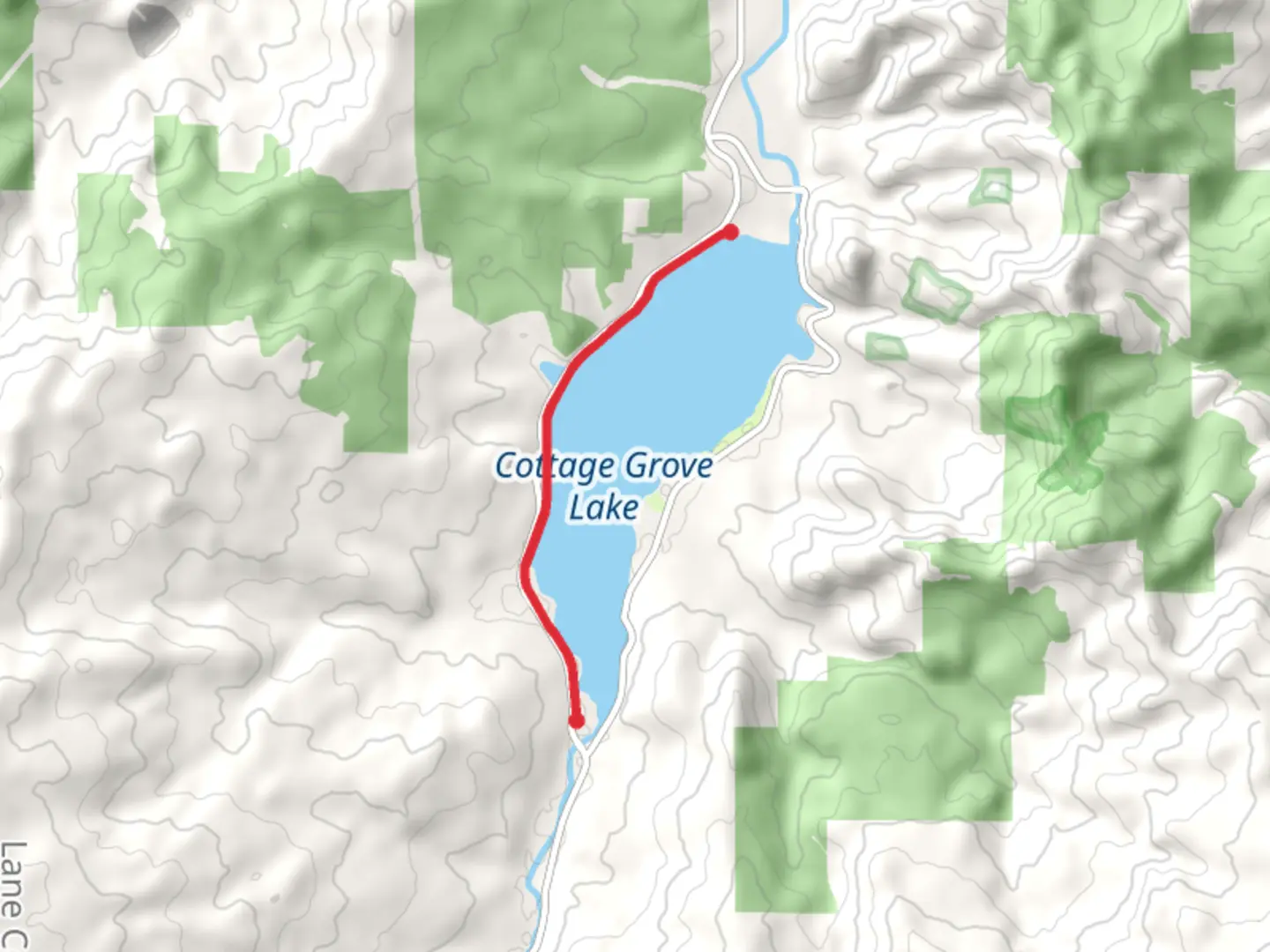 An image depicting the trail Cottage Grove Lake West Shore Walk and its surrounding area.