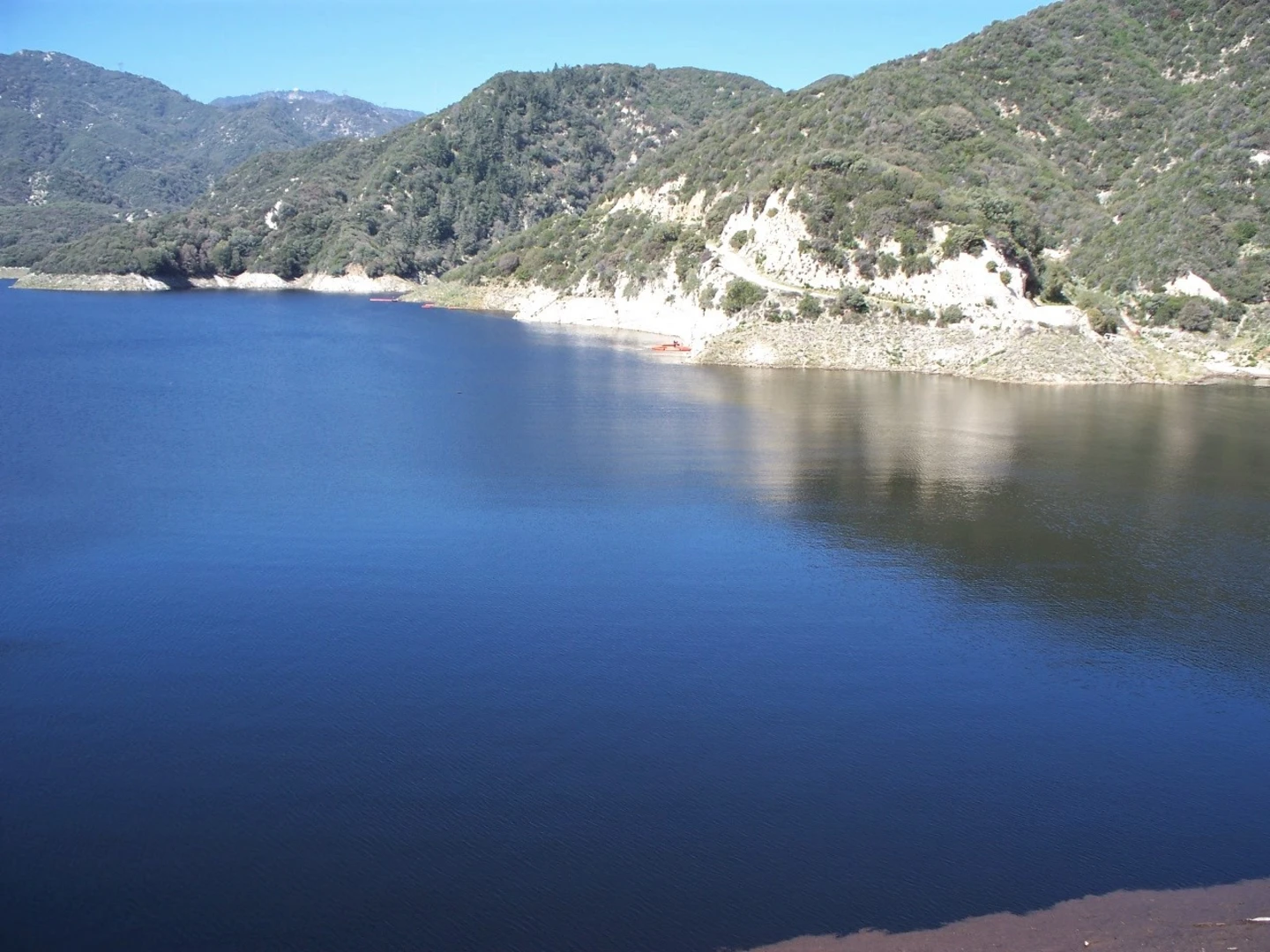 An image depicting the trail Cogswell Reservoir via Devils Canyon Dam Truck Trail and its surrounding area.