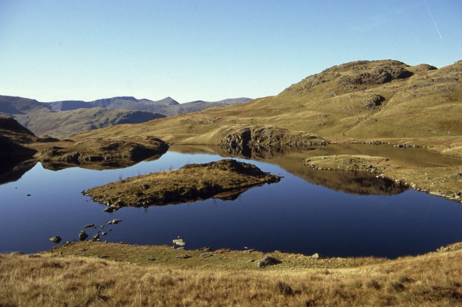 An image depicting the trail Angle Tarn Walk and its surrounding area.