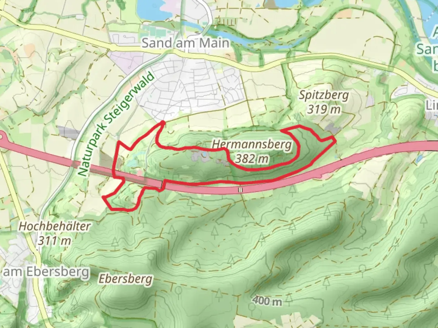 An image depicting the trail Rundwanderweg Sand and Fraenkischer Marienweg Route and its surrounding area.