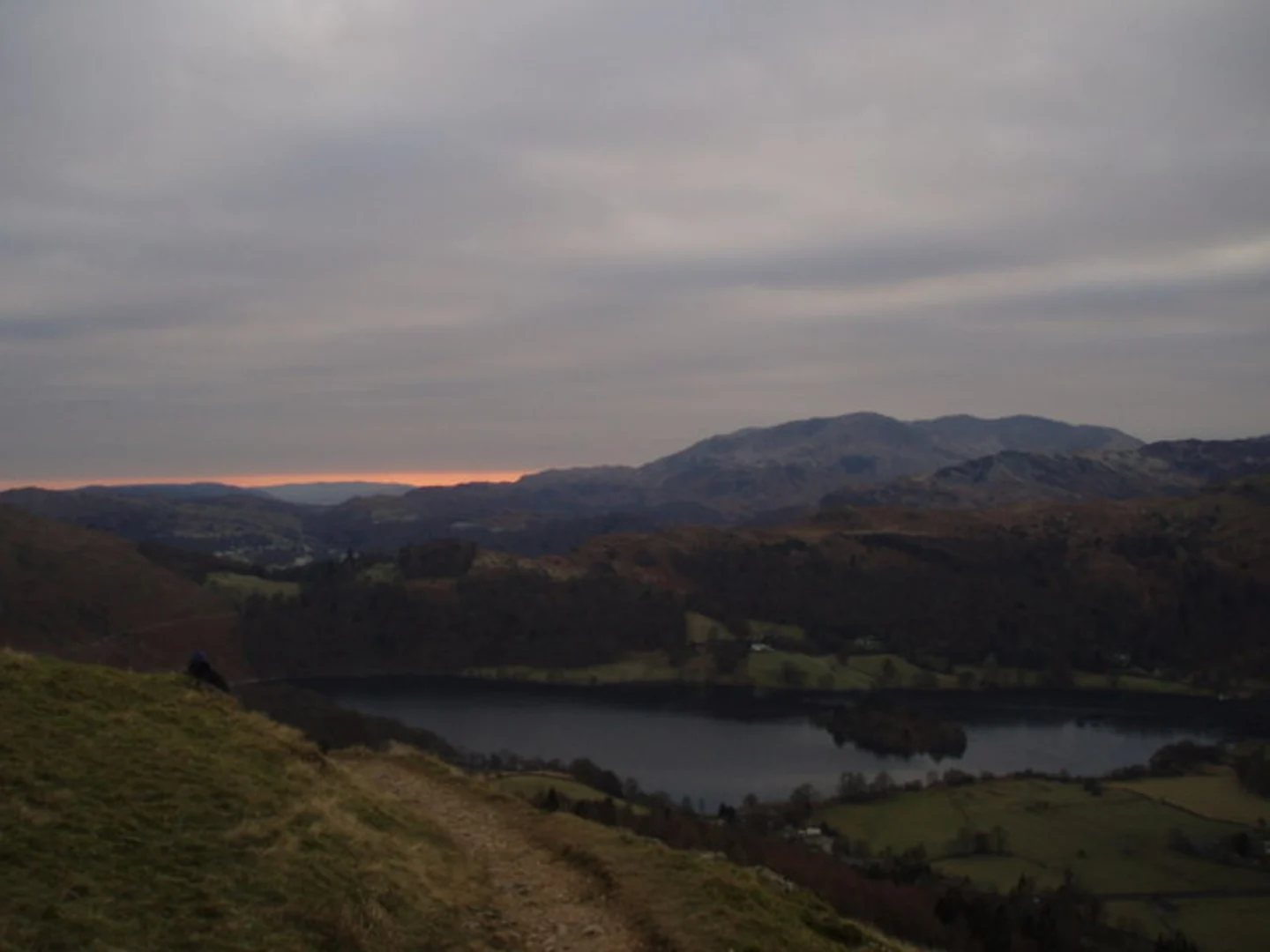 An image depicting the trail Alcock Tarn, Heron Pike and Nab Scar Loop and its surrounding area.