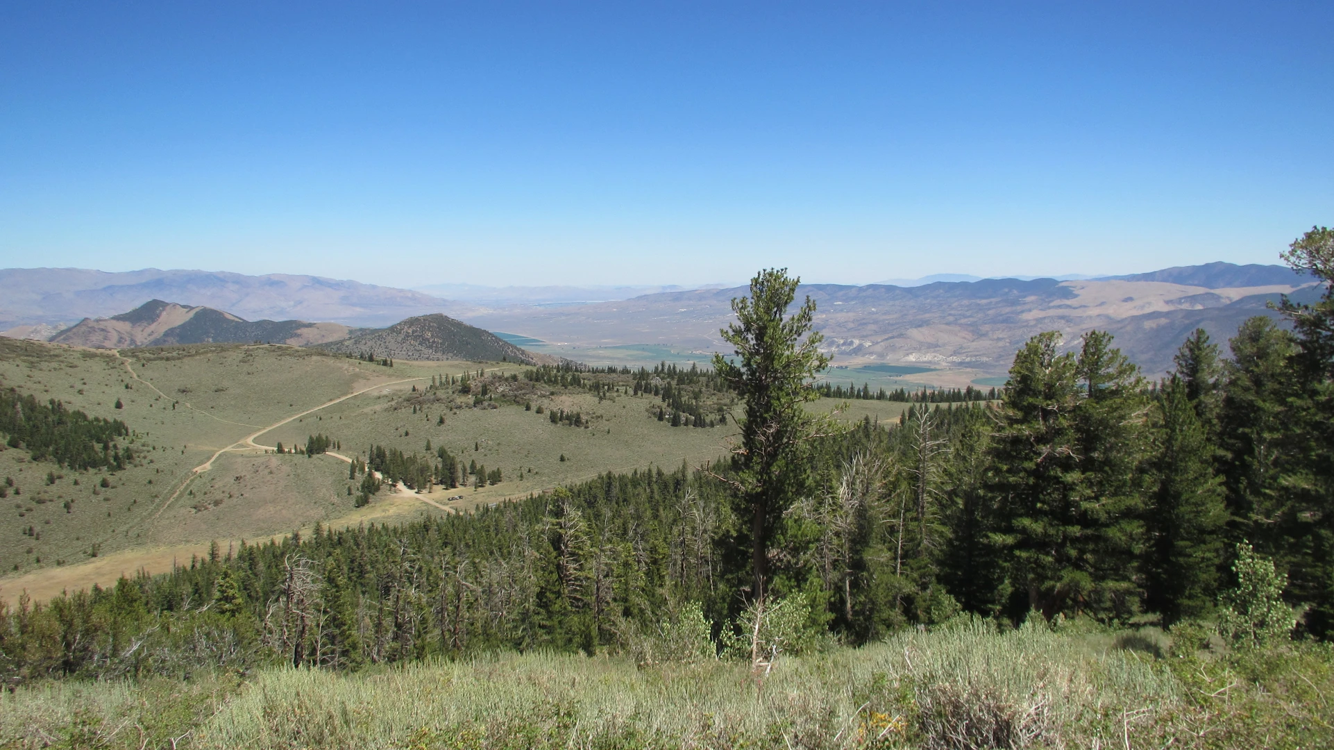 An image depicting the trail Upper Highland Lake via Disaster Creek and its surrounding area.