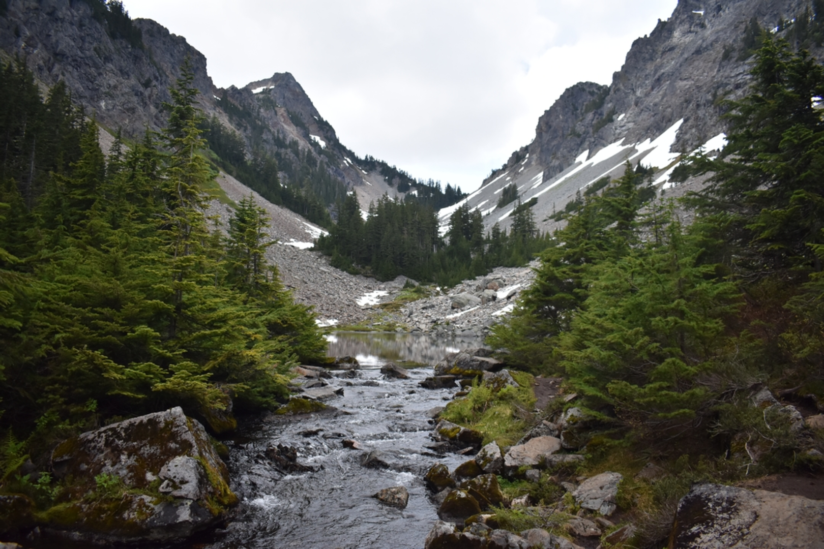 An image depicting the trail Melakwa Lake via Denny Creek Trail and its surrounding area.