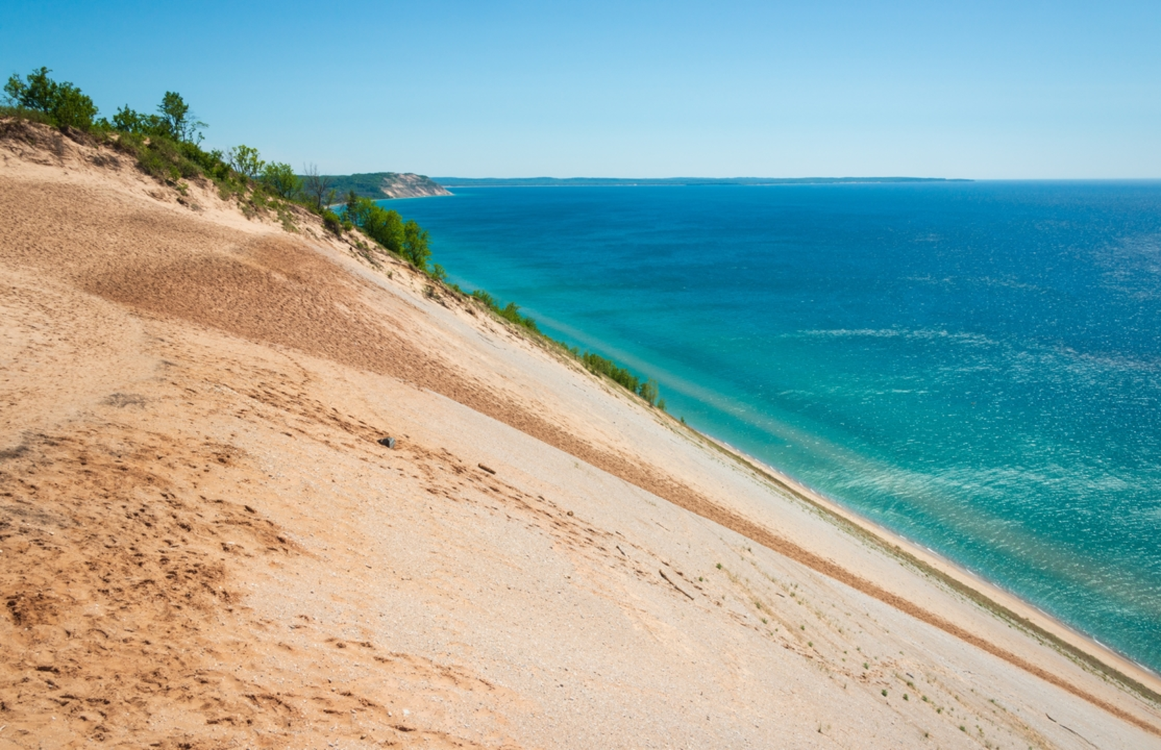 An image depicting the trail Sleeping Bear Point Loop Trail and its surrounding area.