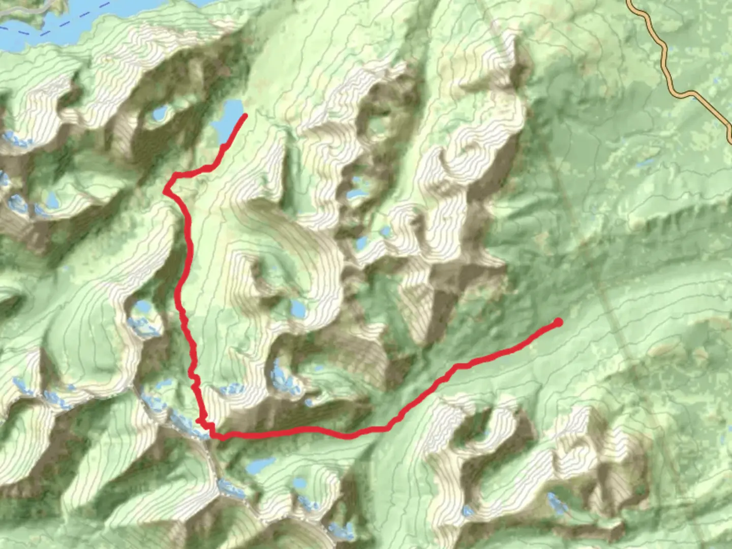 An image depicting the trail Red Eagle Lake via Pitamakan Pass and its surrounding area.