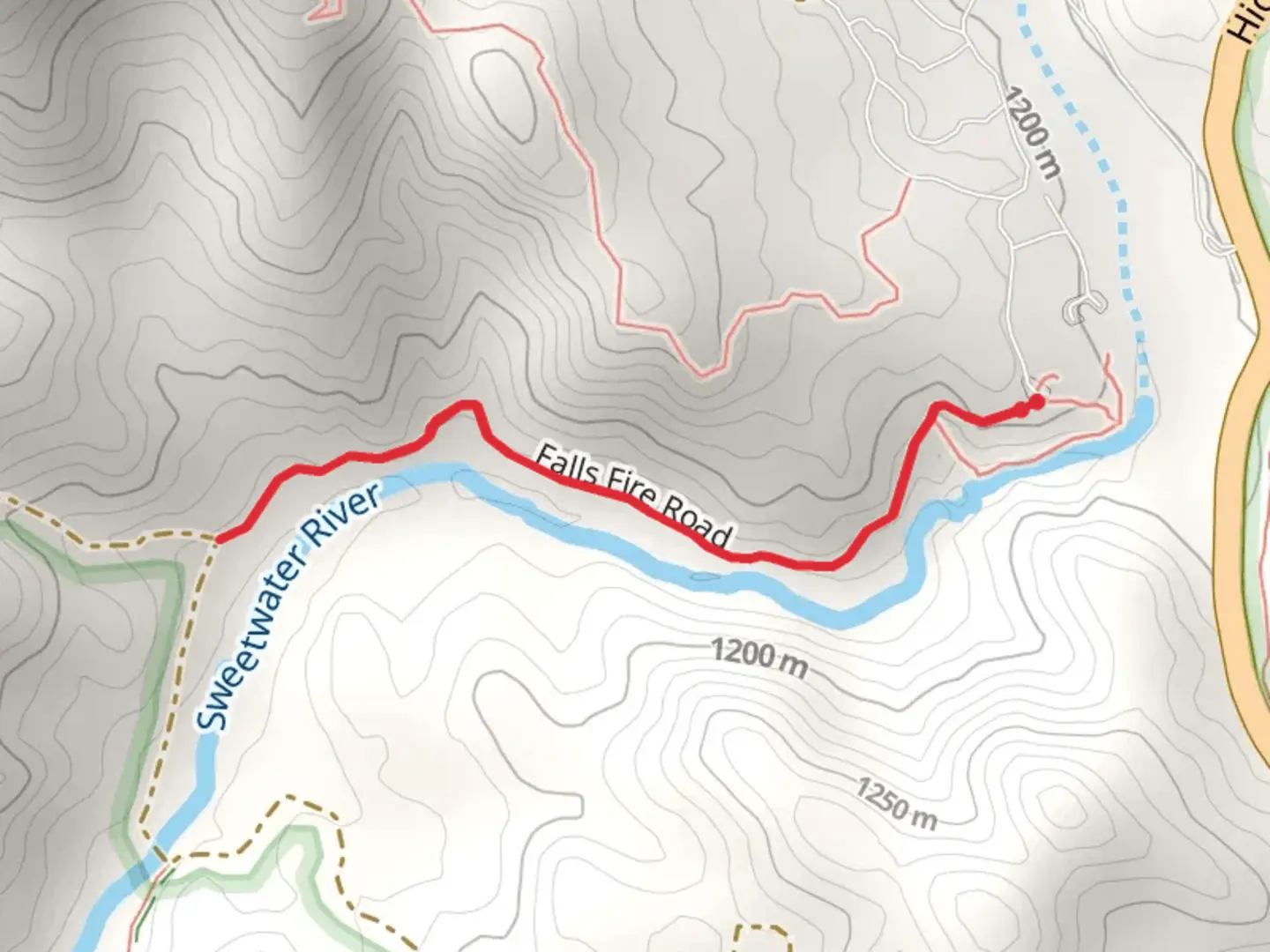 An image depicting the trail Falls Fire Road and its surrounding area.