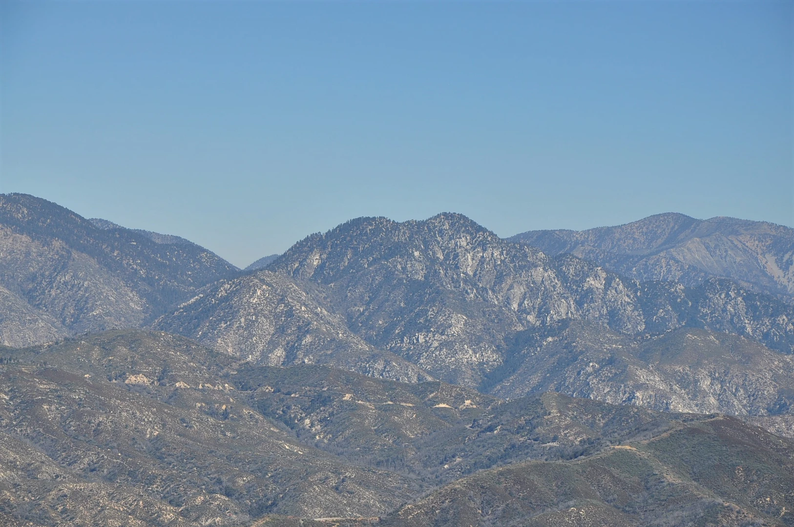 An image depicting the trail Gabrielino, Bear Canyon, Markham Saddle and San Gabriel Peak Loop Trail and its surrounding area.
