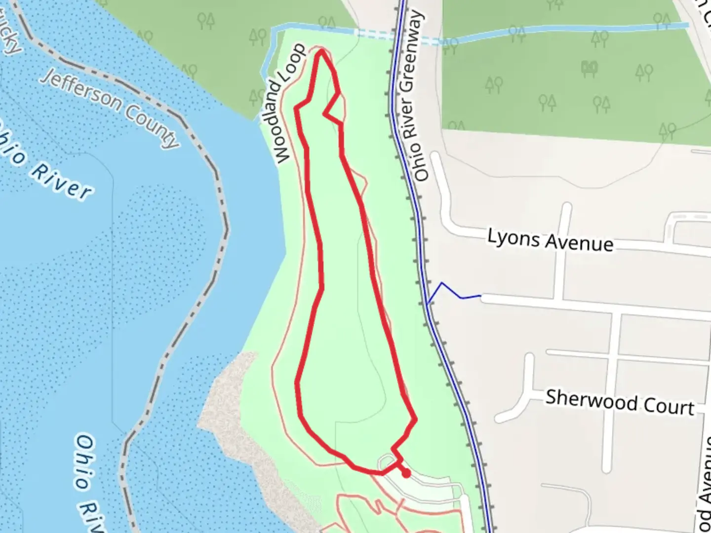 An image depicting the trail Woodland Loop and its surrounding area.