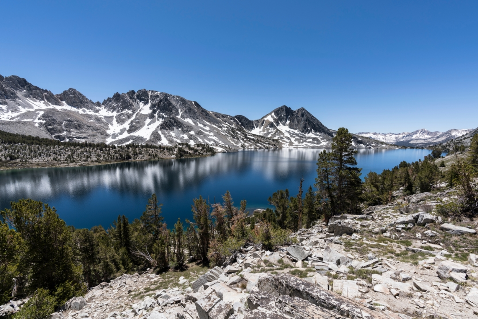 An image depicting the trail Duck Lake via Duck Pass Trail and its surrounding area.