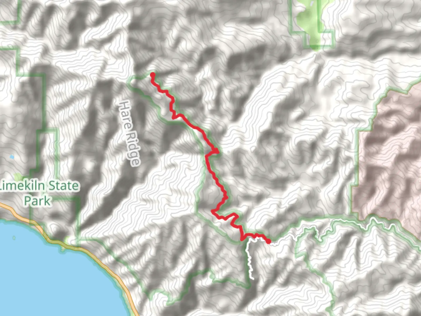 An image depicting the trail Cone Peak Road from Nacimiento-Fergusson Road and its surrounding area.