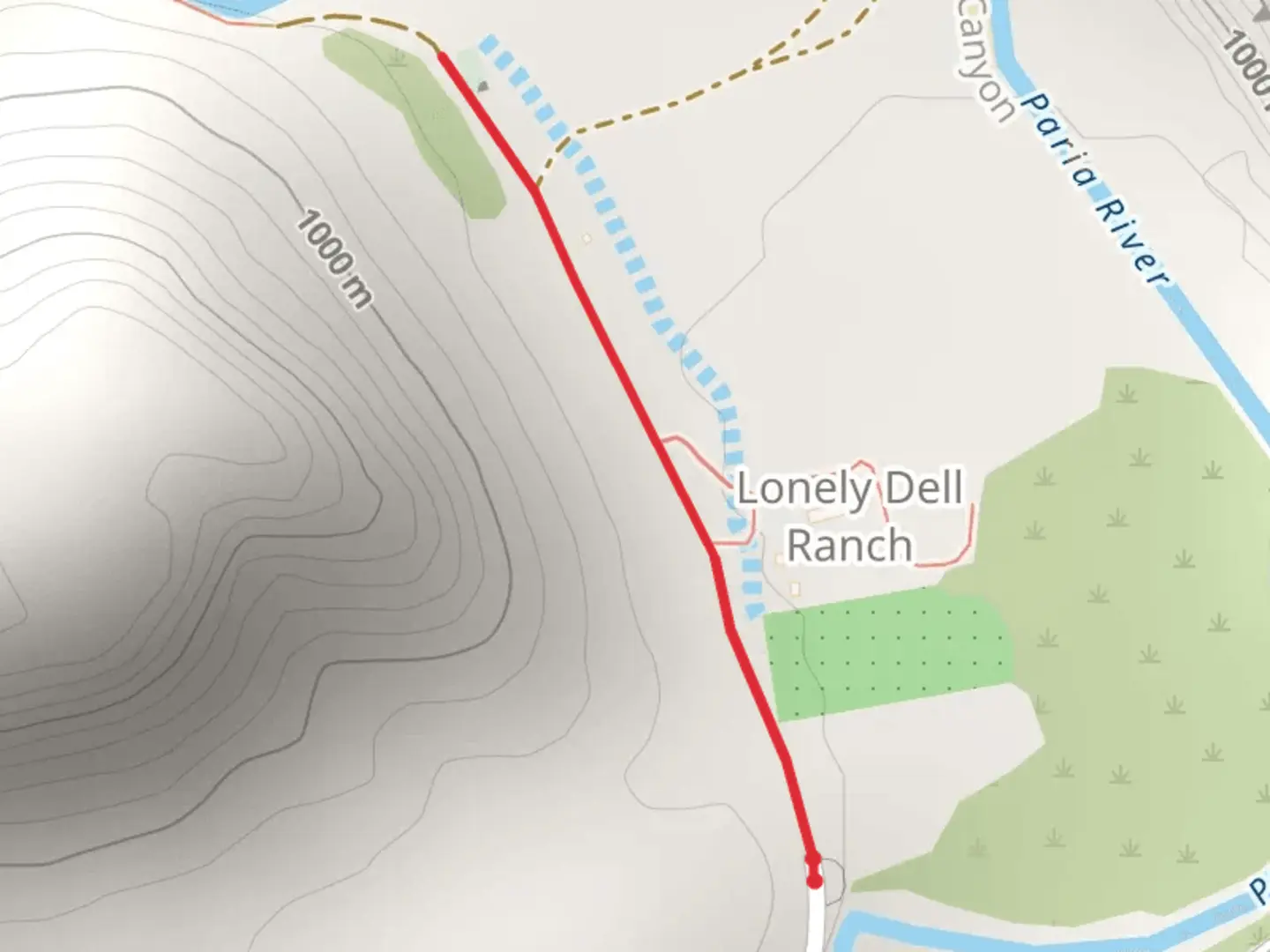 An image depicting the trail Lonely Dell Cemetery from Paria River and its surrounding area.