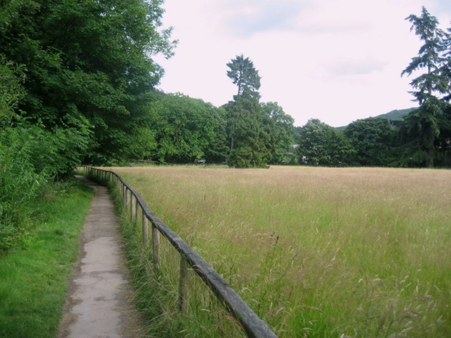 An image depicting the trail Grasmere Riverside and Wordsworth Grave Loop from Grasmere and its surrounding area.