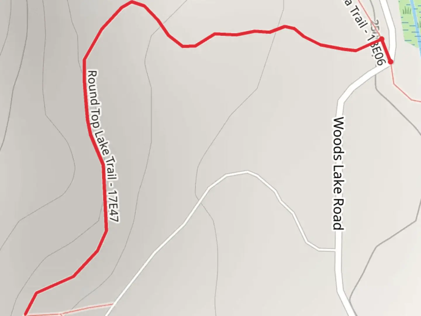 An image depicting the trail Woods Lake Road and its surrounding area.