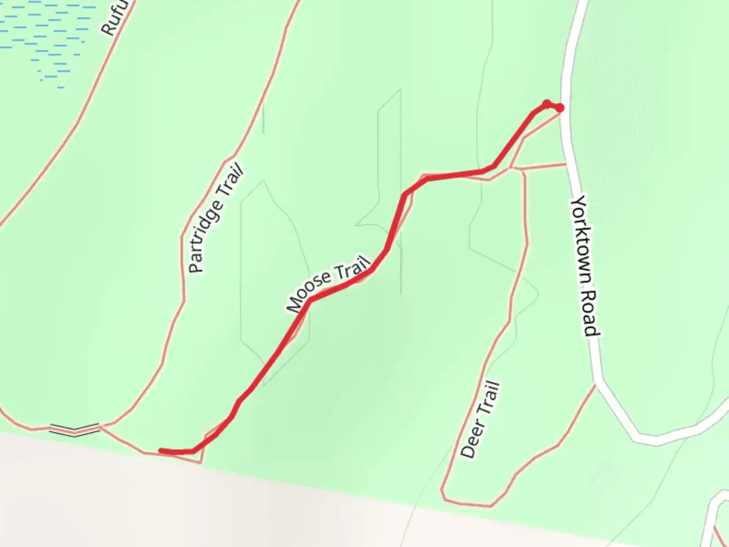 An image depicting the trail Moose Trail from Yorktown Road and its surrounding area.