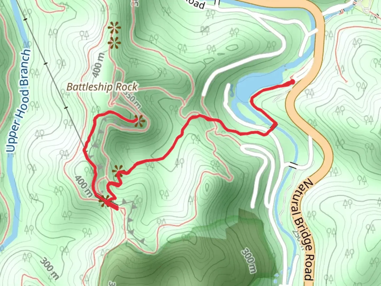 An image depicting the trail Battleship Rock via Original Natural Bridge Trail and its surrounding area.