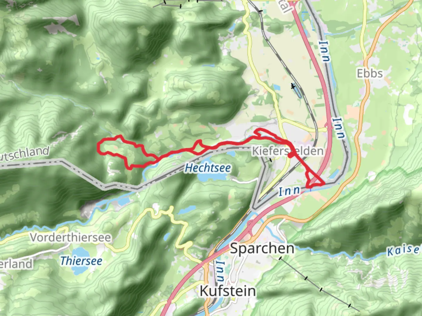 An image depicting the trail Kiefersfelden and Althausl Loop via Kieferbach and its surrounding area.