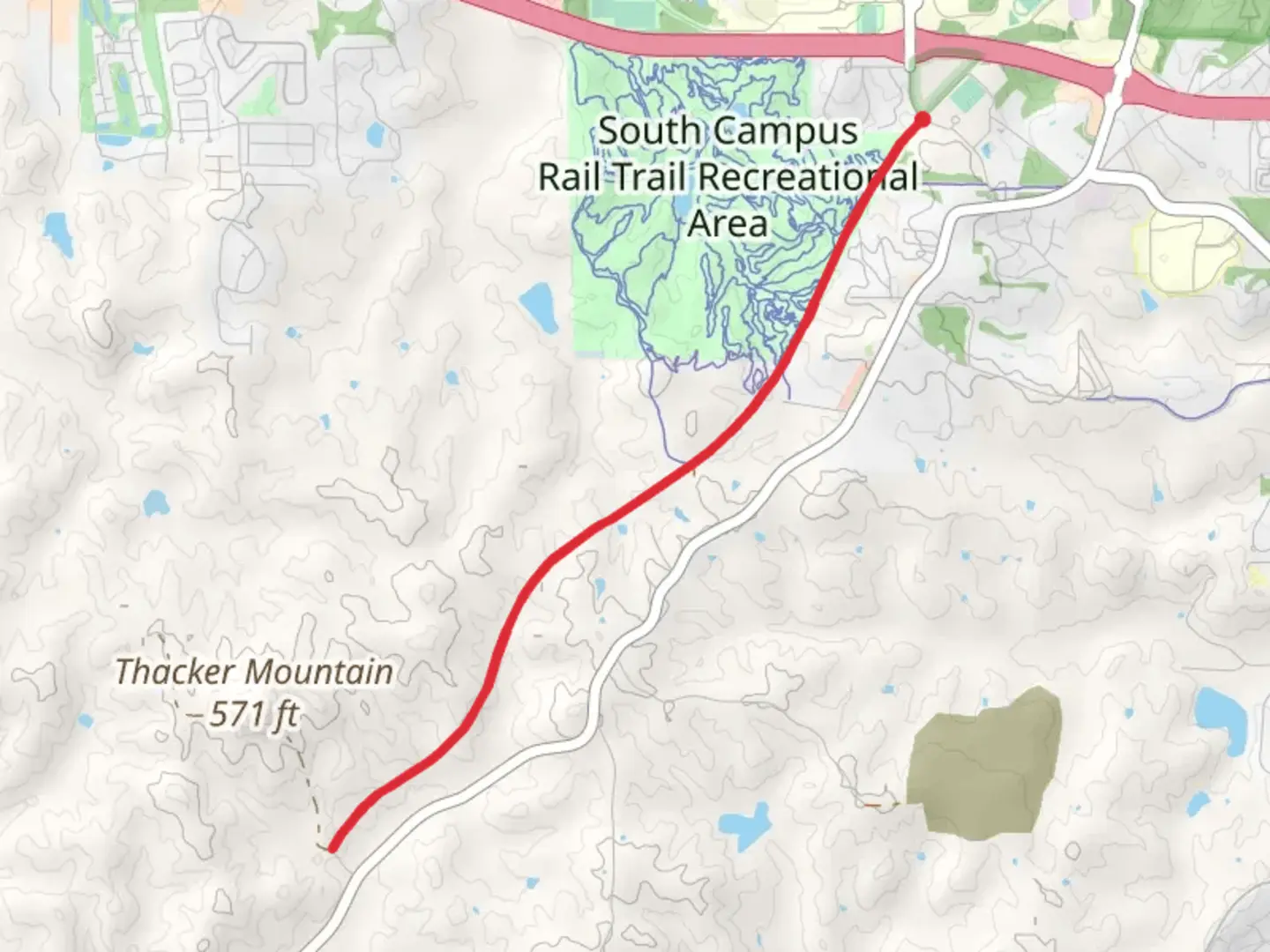 An image depicting the trail South Campus Rail Trail and its surrounding area.