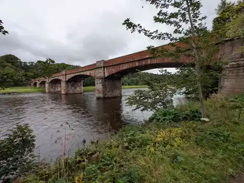 An image depicting the trail River Tweed and Dryburgh Abbey and its surrounding area.