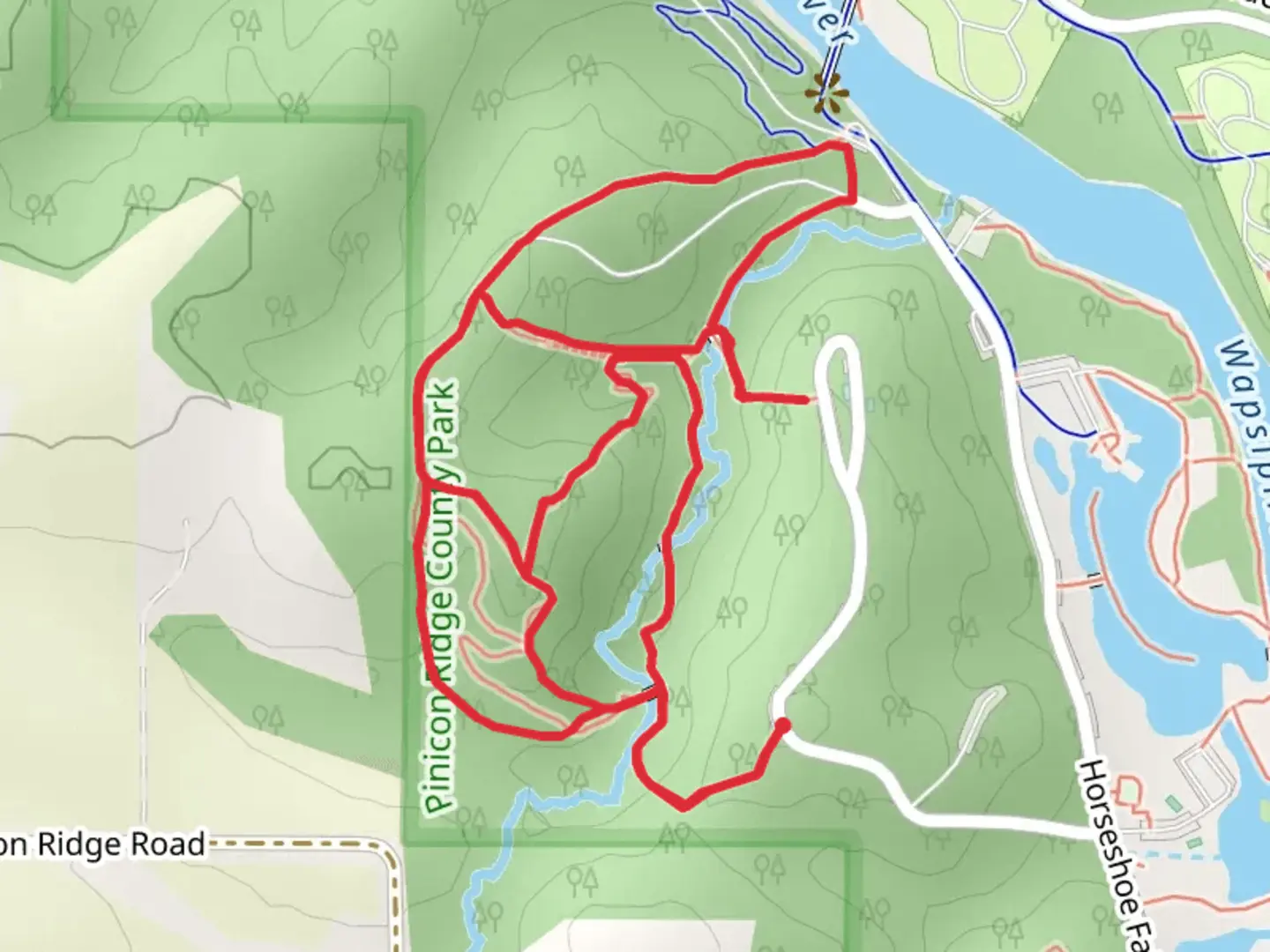 An image depicting the trail Woodpecker Hill Loop Trail and its surrounding area.
