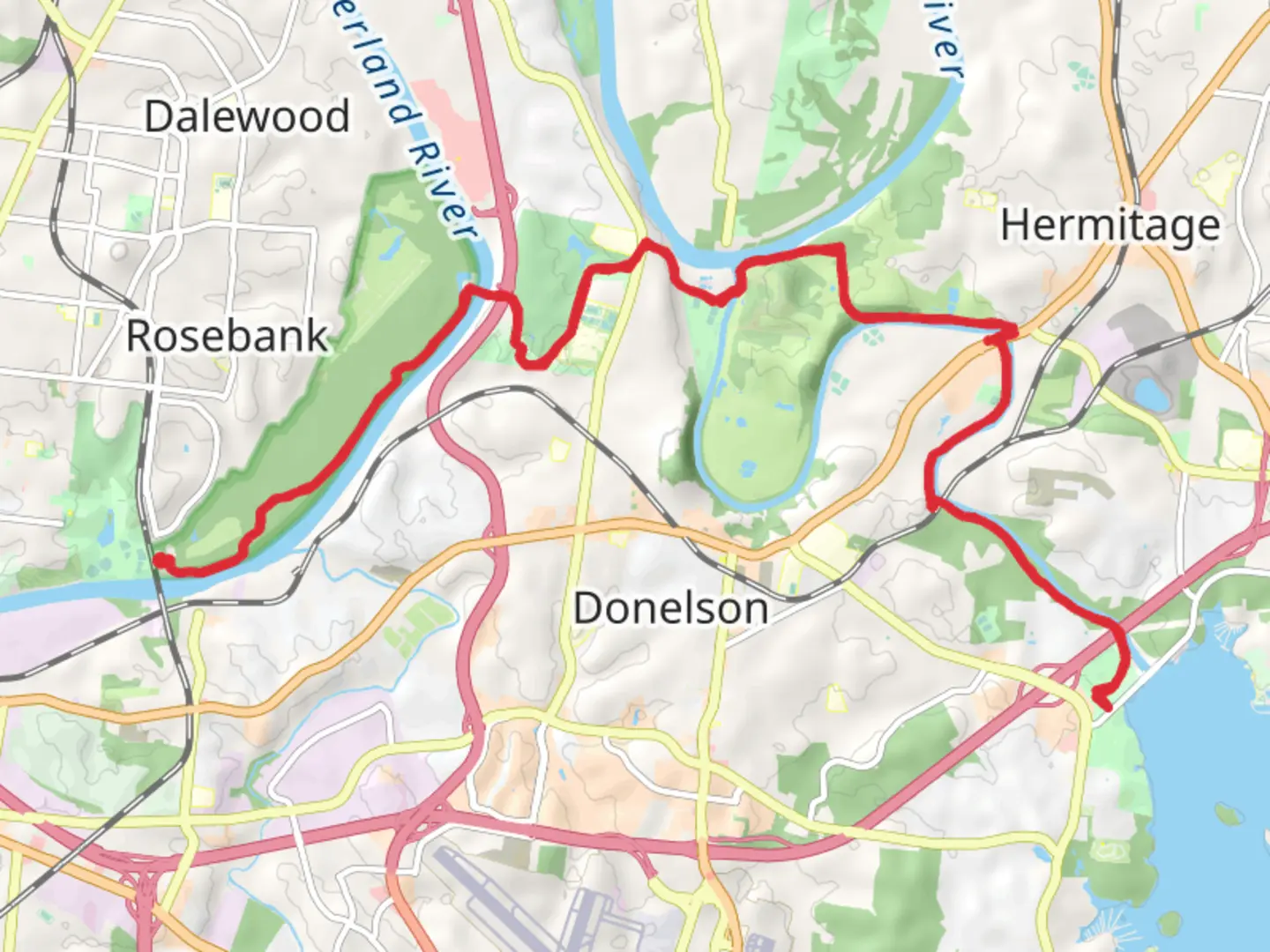 An image depicting the trail Stones River Greenway and its surrounding area.
