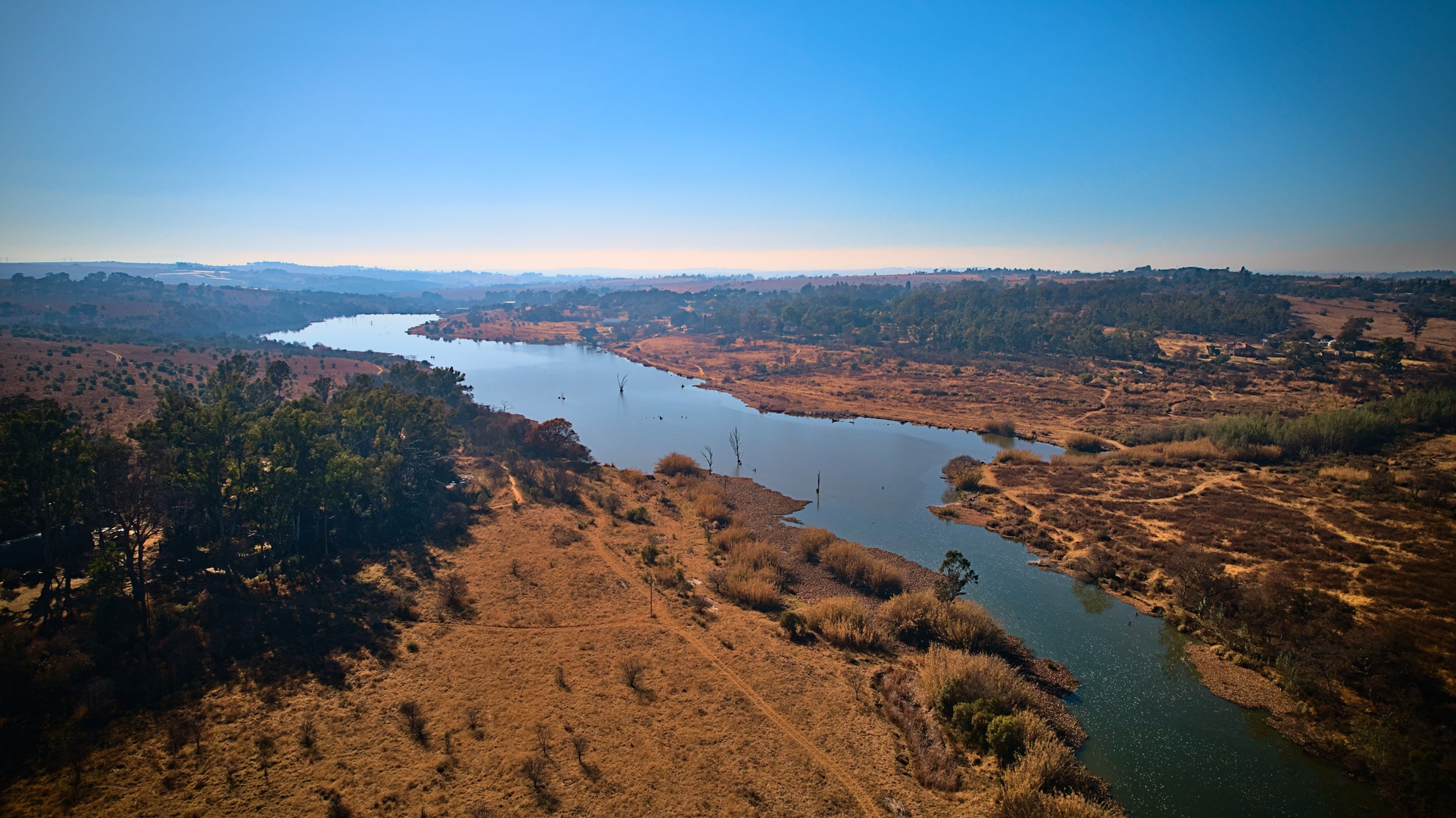 An image depicting the trail East Shore and Heron Bay Loop Trail - Lake Del Valle and its surrounding area.