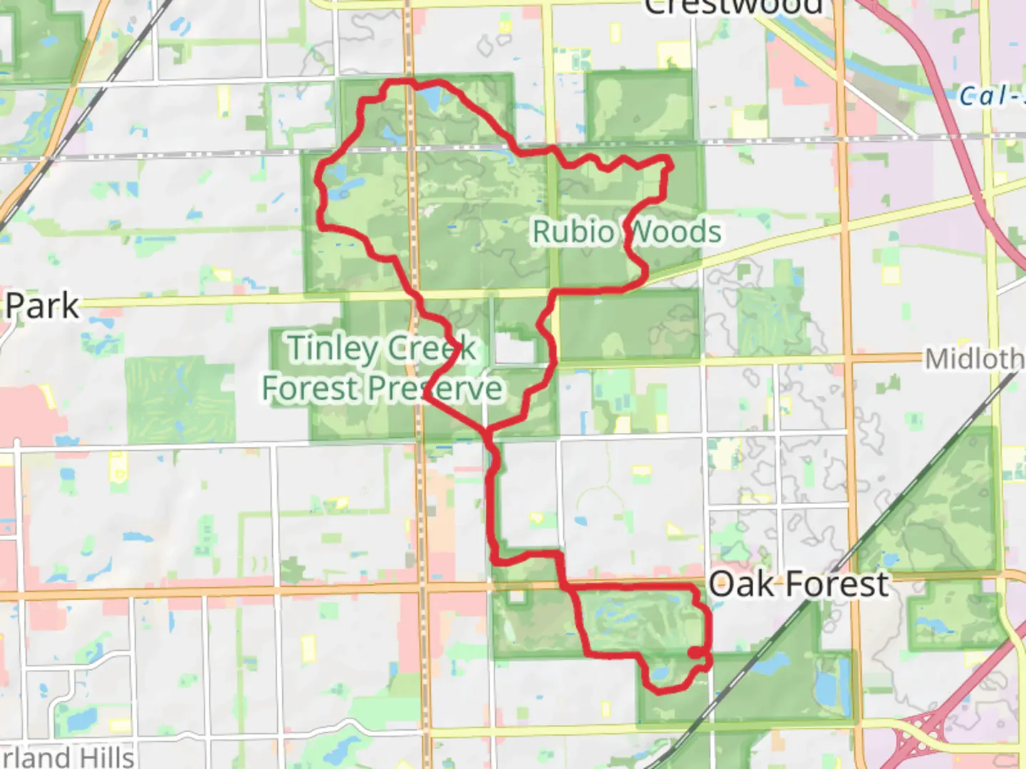 An image depicting the trail Tinley Creek Purple and Red Paved Trail and its surrounding area.