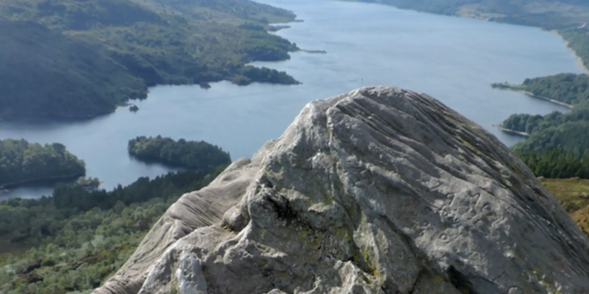 An image depicting the trail Primrose Hill Loop via Loch Katrine and its surrounding area.