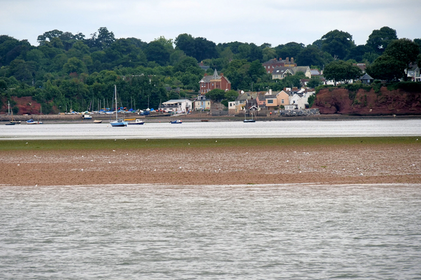 An image depicting the trail Exmouth to Dawlish Warren Walk via Lympstone Lake and its surrounding area.