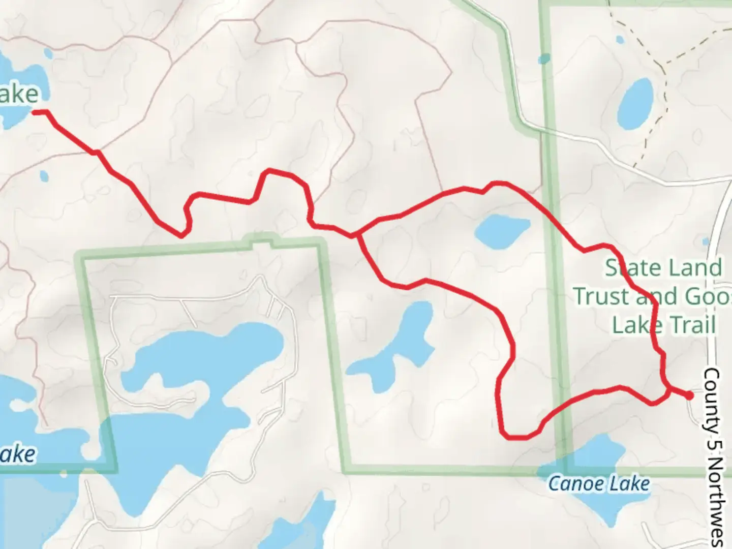 An image depicting the trail Goose Lake from County 5 Northwest and its surrounding area.