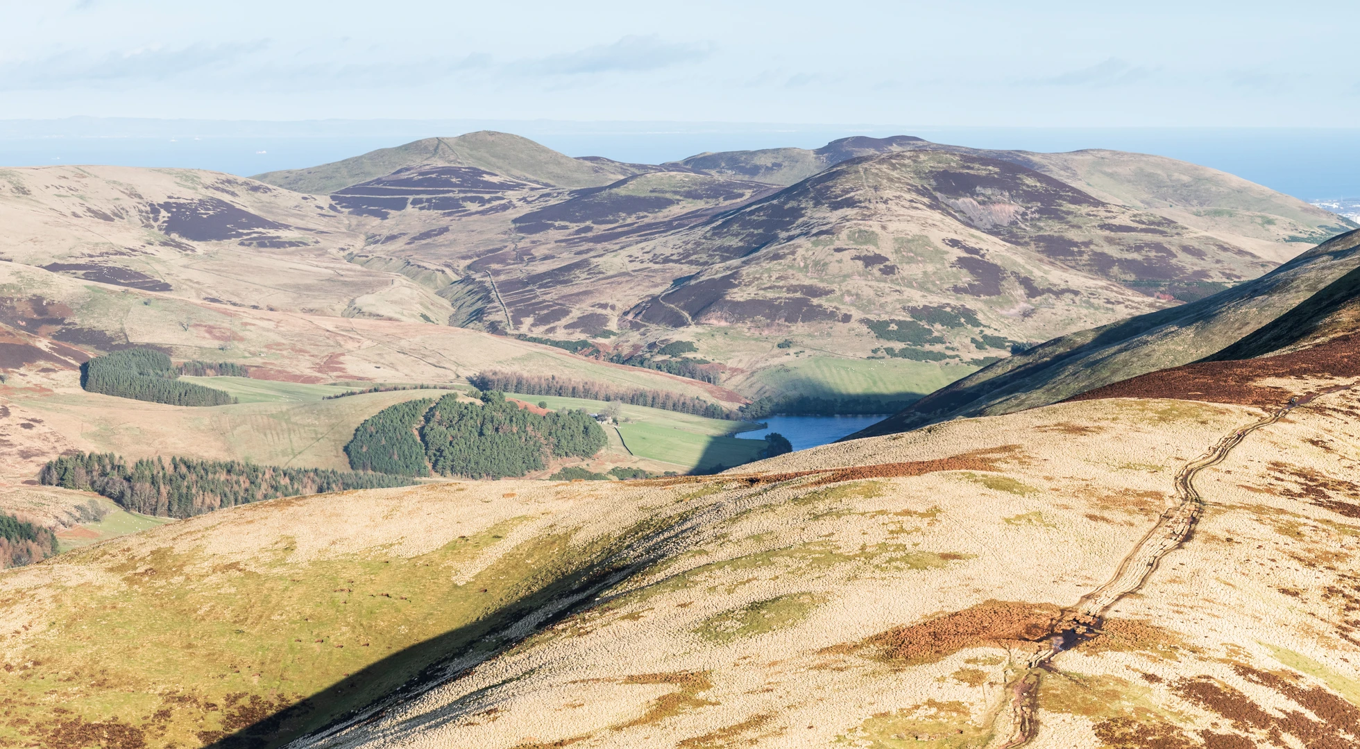 An image depicting the trail Scald Law, South Black Hill, West Kip, Loganlee Reservoir and Carnethy Hill Loop and its surrounding area.