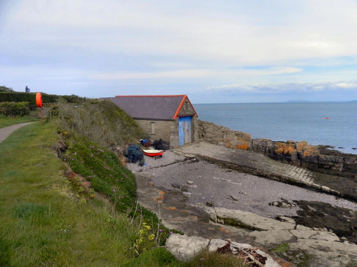 An image depicting the trail Benllech to Moelfre Coastal Path Walk and its surrounding area.