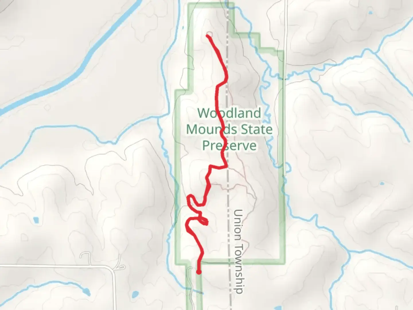 An image depicting the trail Woodland Mounds Trail and its surrounding area.